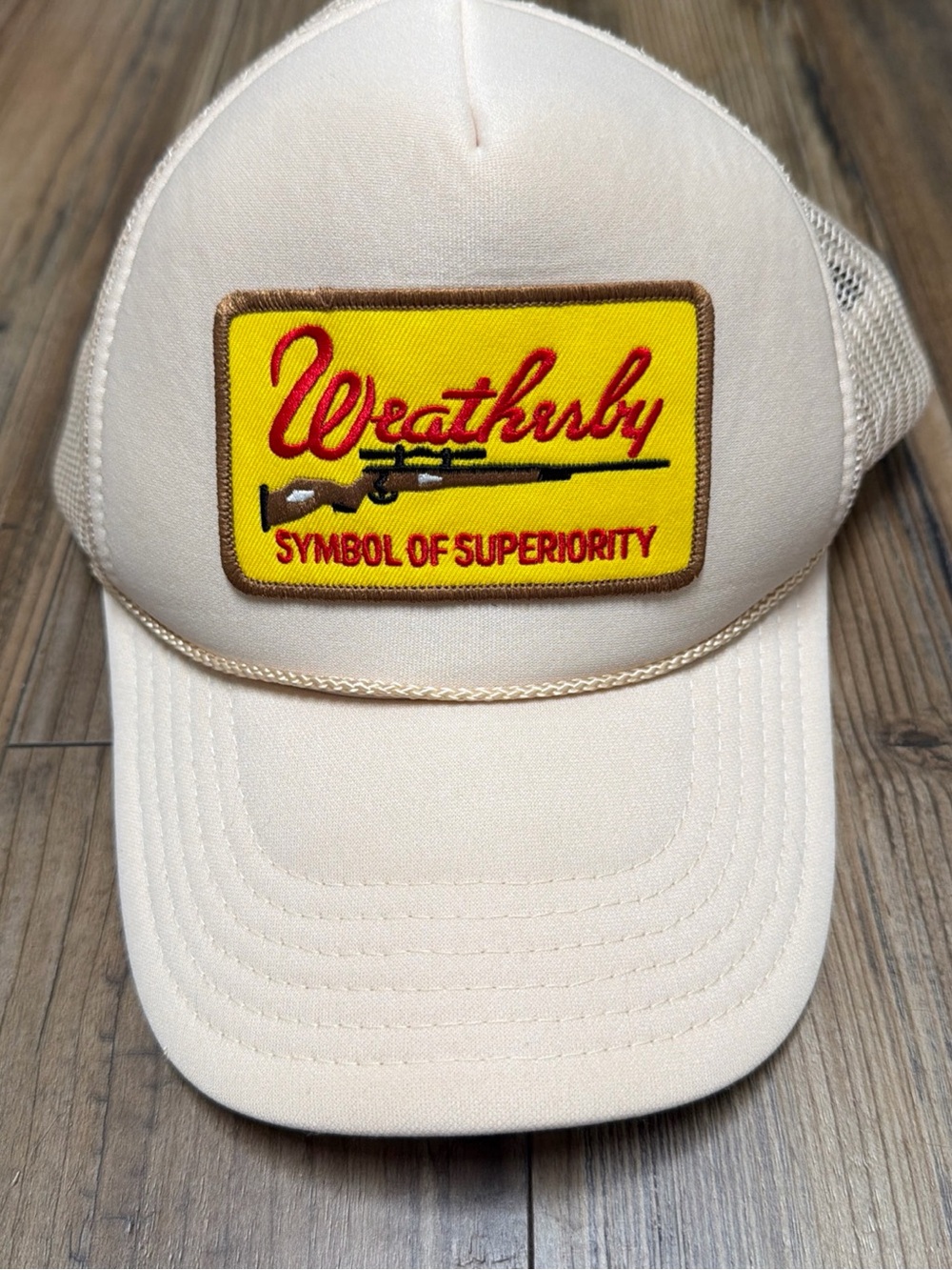 Weatherby Yellow Patch “symbol of superiority” Beige Trucker Hat snap back